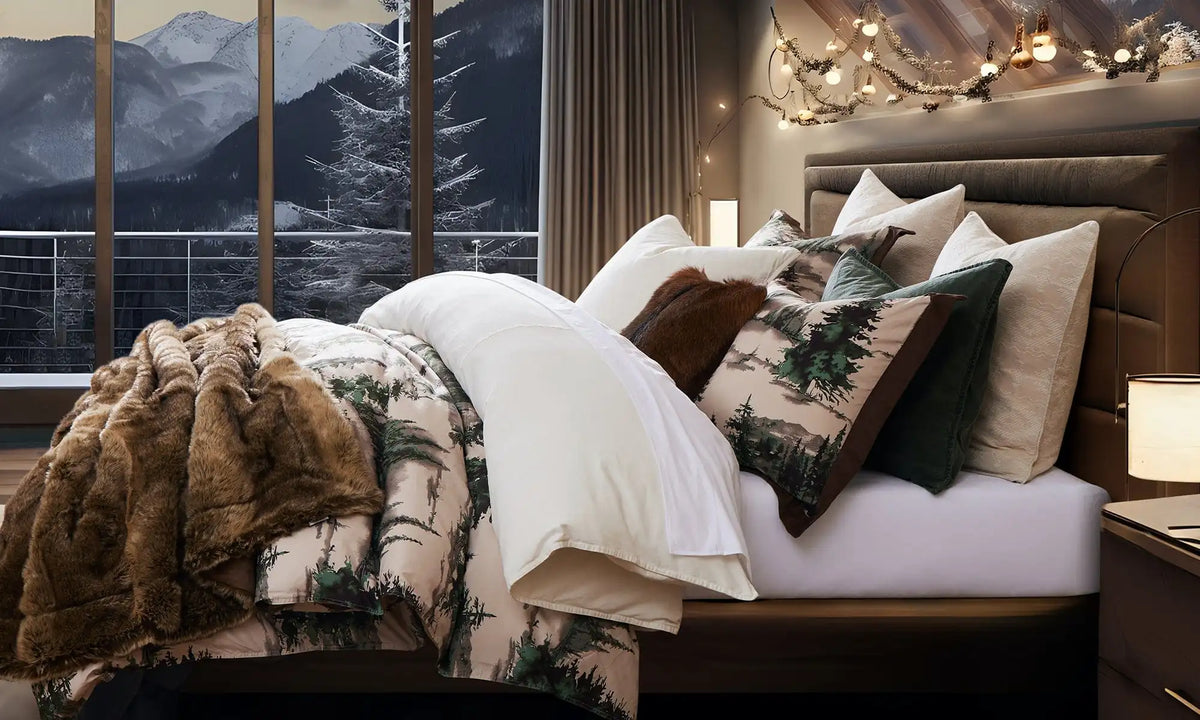 The Joshua comforter set and a faux fur throw in a mountain lodge bedroom at Christmas