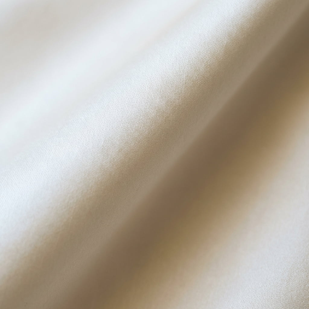 Close-up of smooth ivory Eucalyptus lyocell fabric with a soft sheen