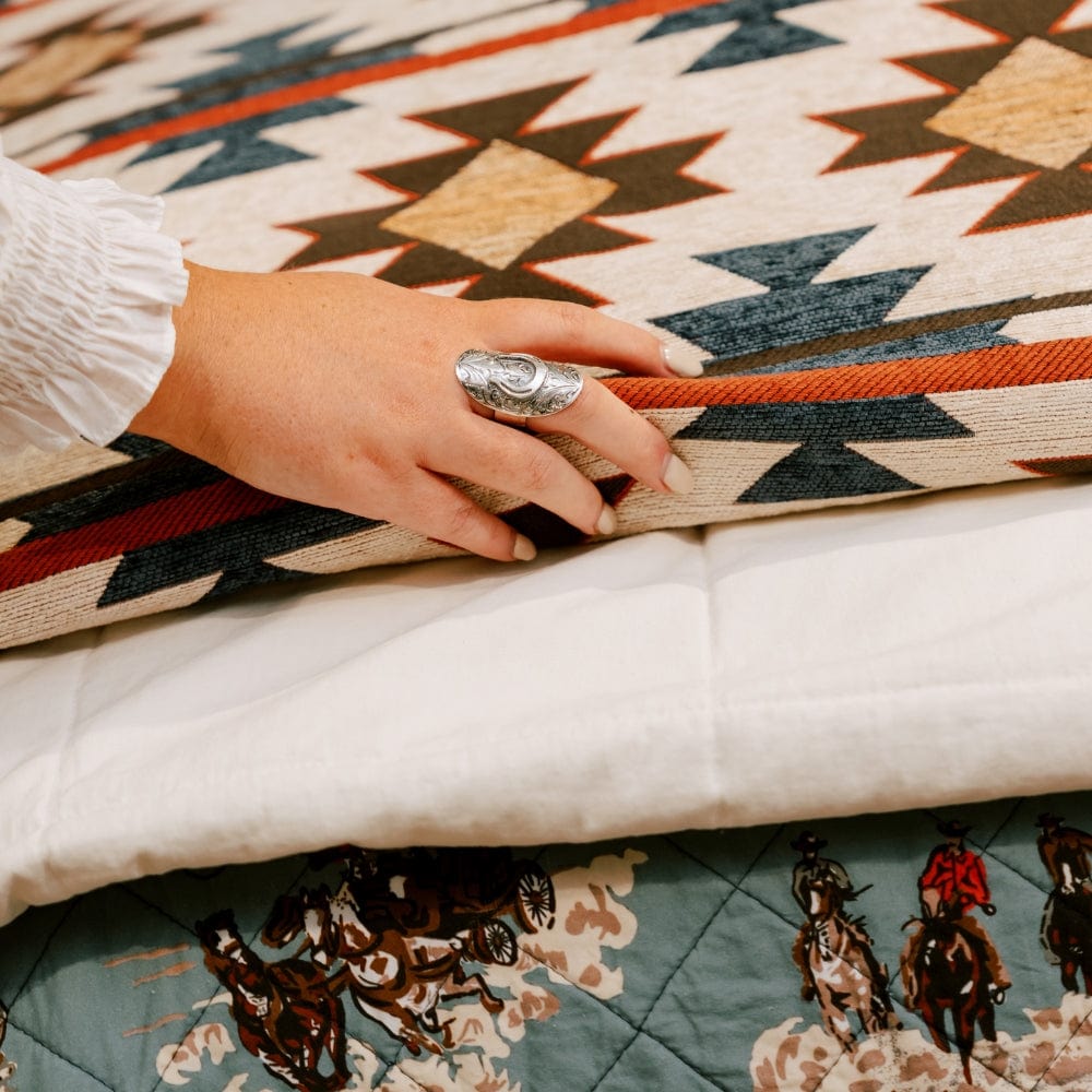 Tasha Polizzi Mariella chenille bedding styled in a layered Western room